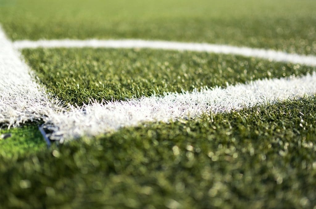 Close-up of lines drawn on a football field.